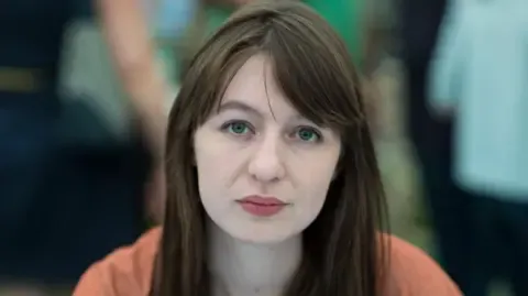 Sally Rooney claims she is unable to visit the UK due to potential arrest